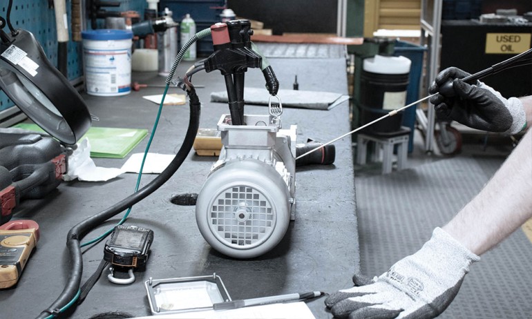 NORD technician examining a gear unit